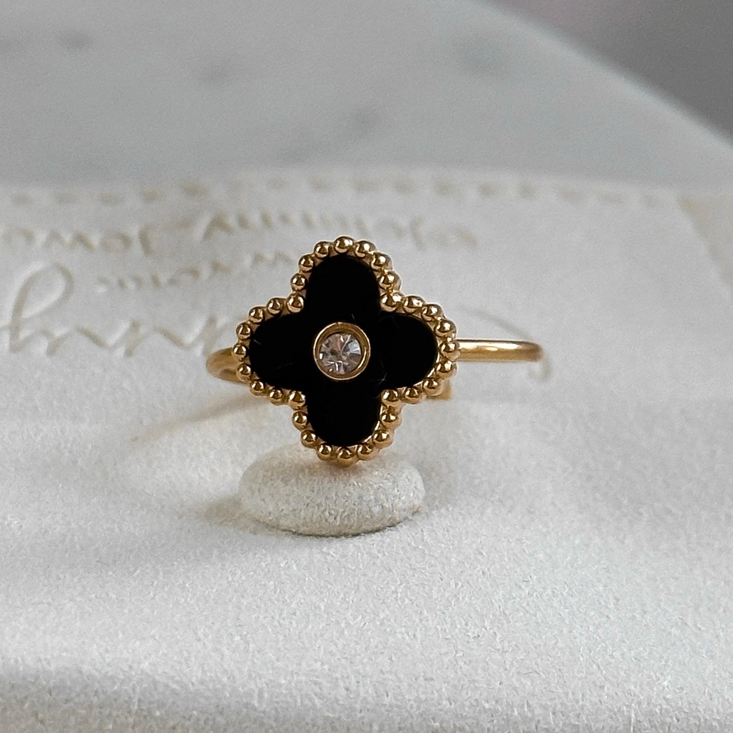 Black onyx and crystal clover ring