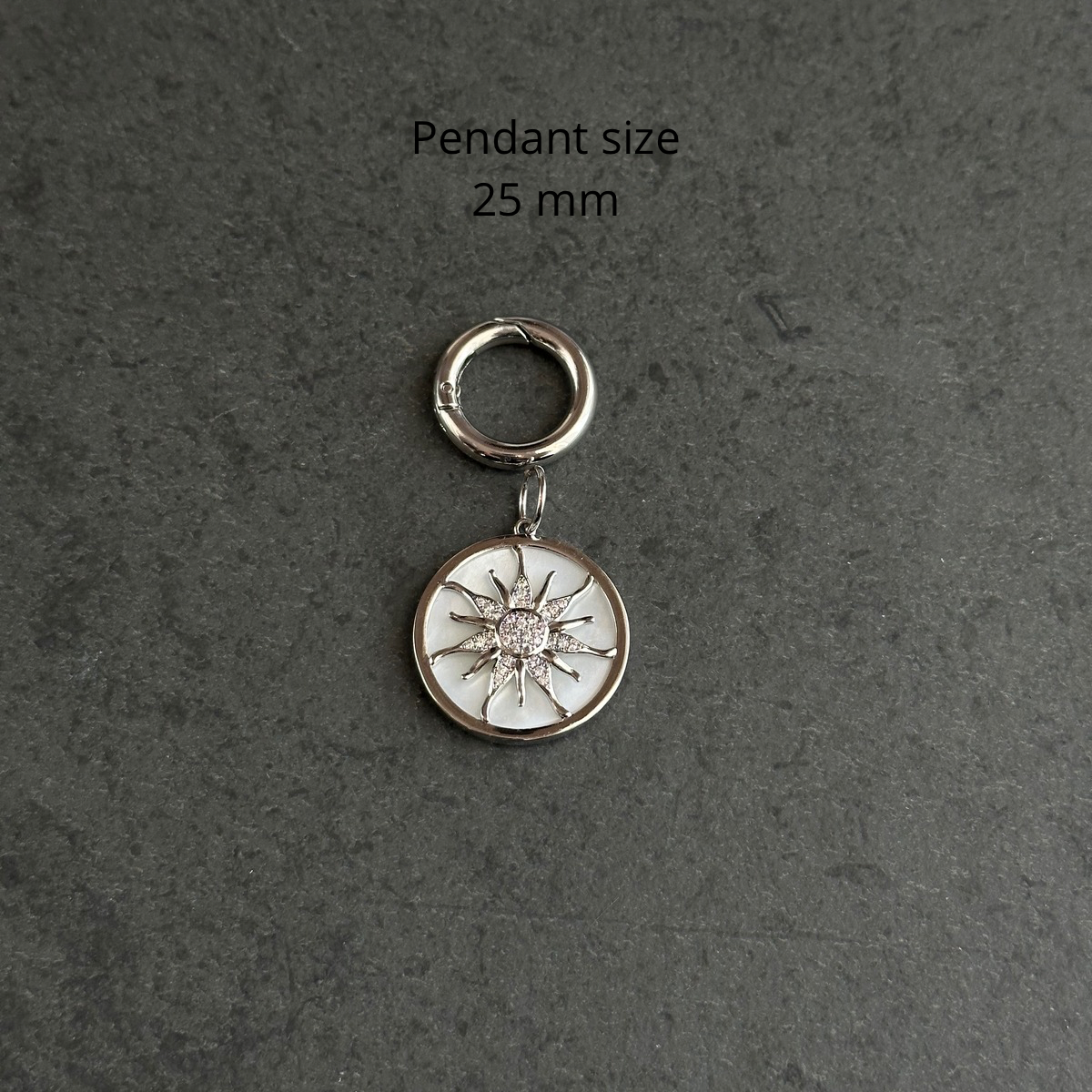 Necklace charm (sun on mother-of-pearl base)