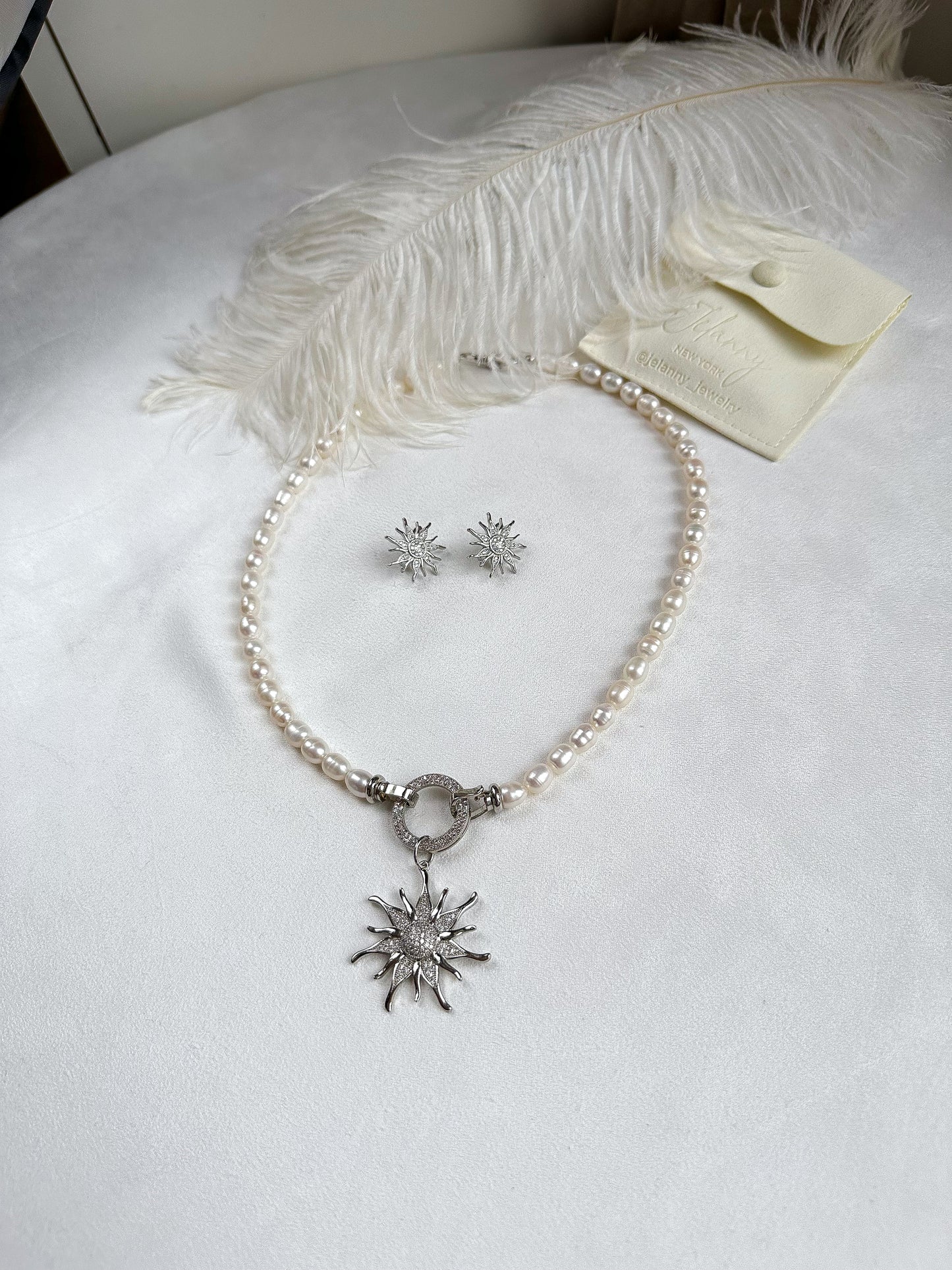 Necklace with sunshine pendant (rhodium plated)