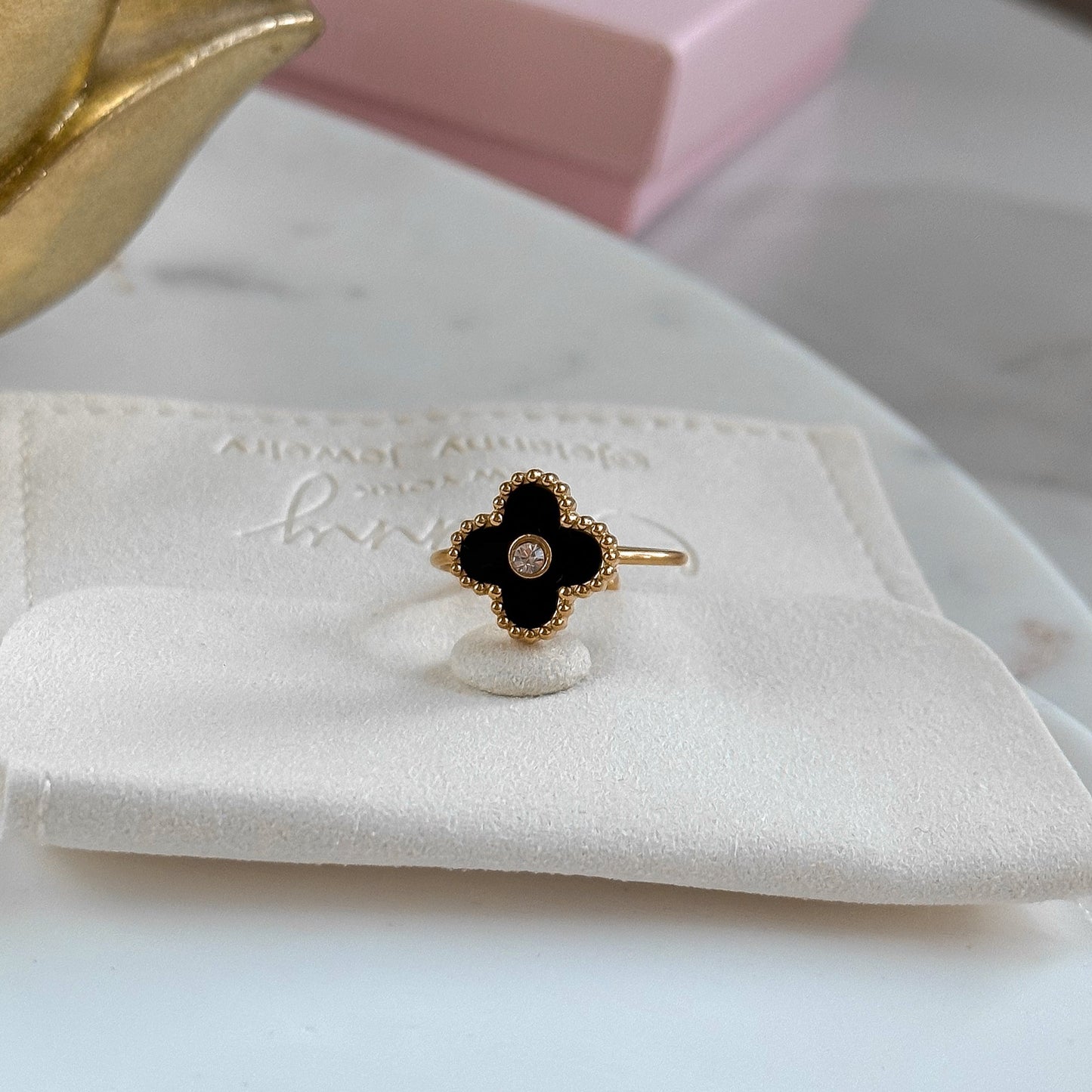 Black onyx and crystal clover ring