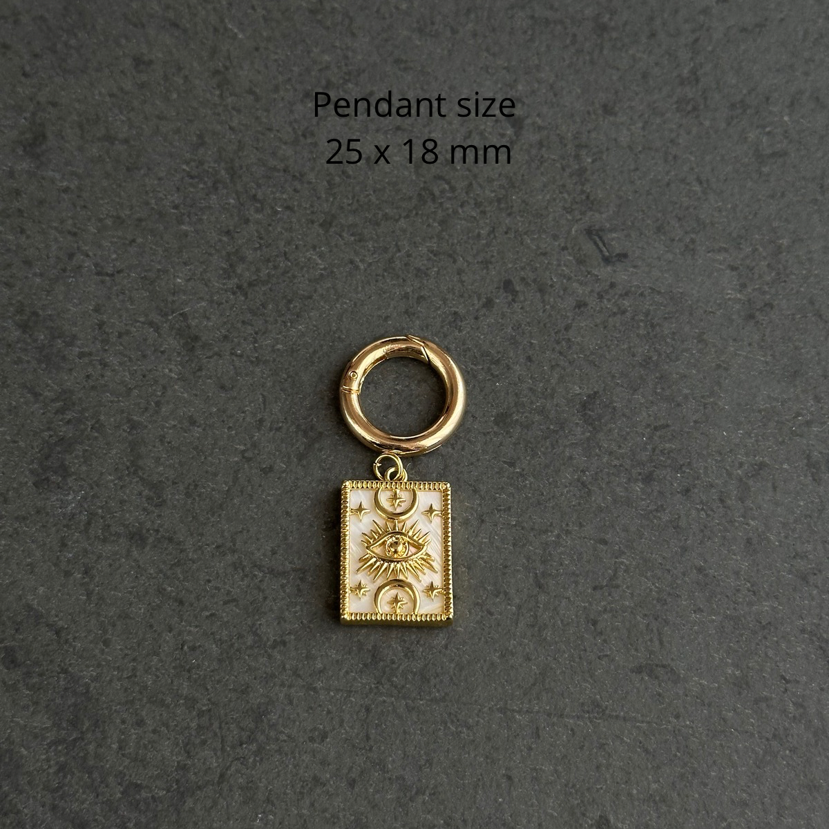 Necklace charm (sun eye on mother-of-pearl base)
