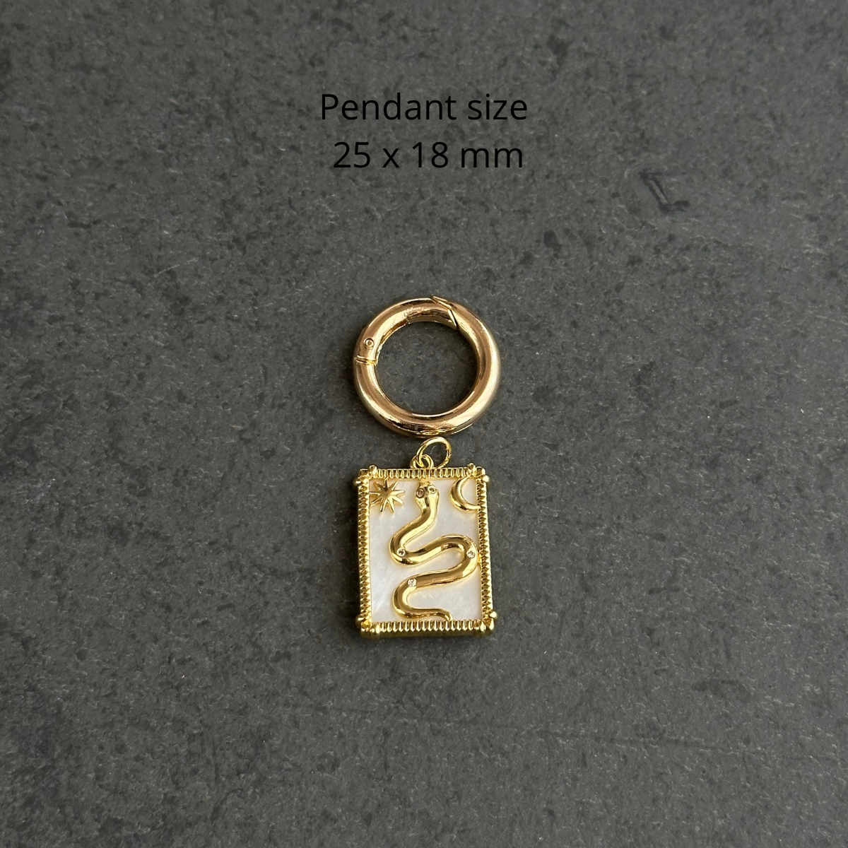 Necklace charm (snake on mother-of-pearl base)