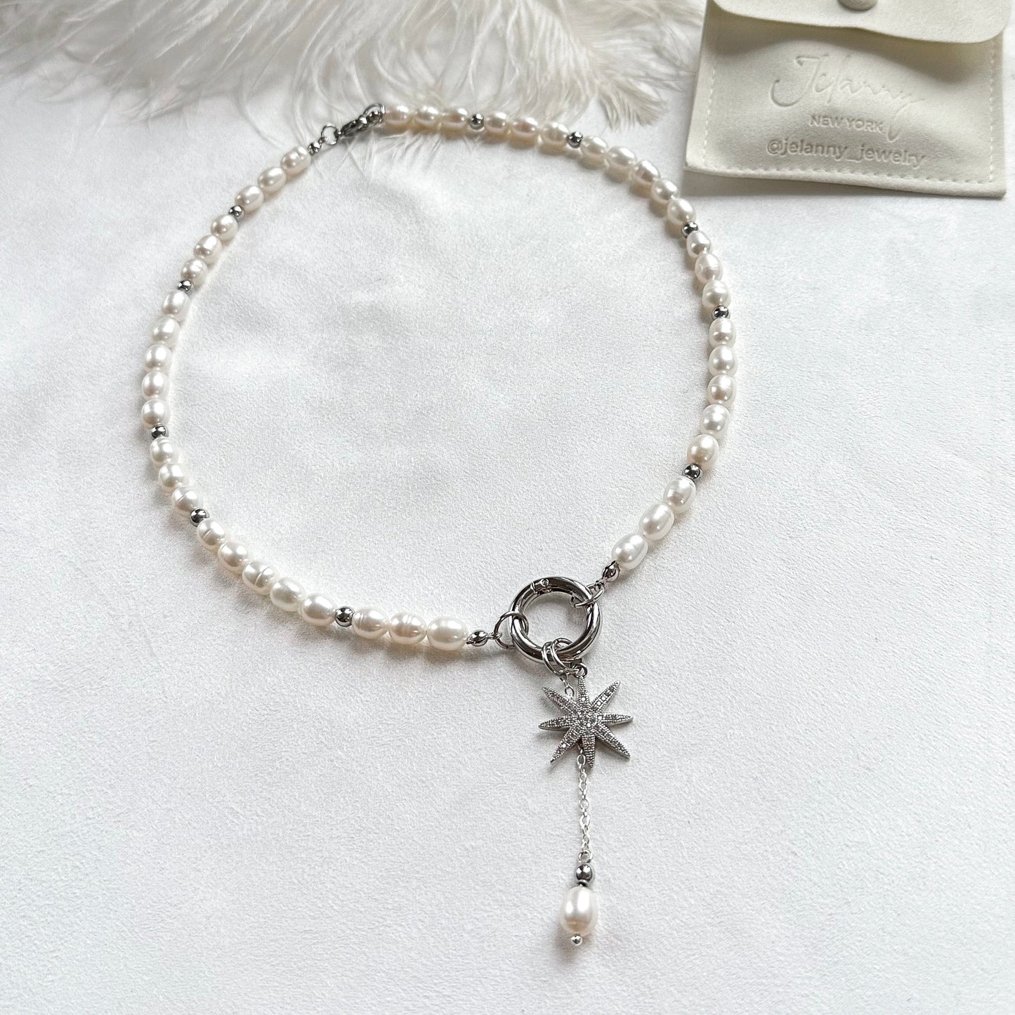 Necklace with star and pearl interchangeable pendants
