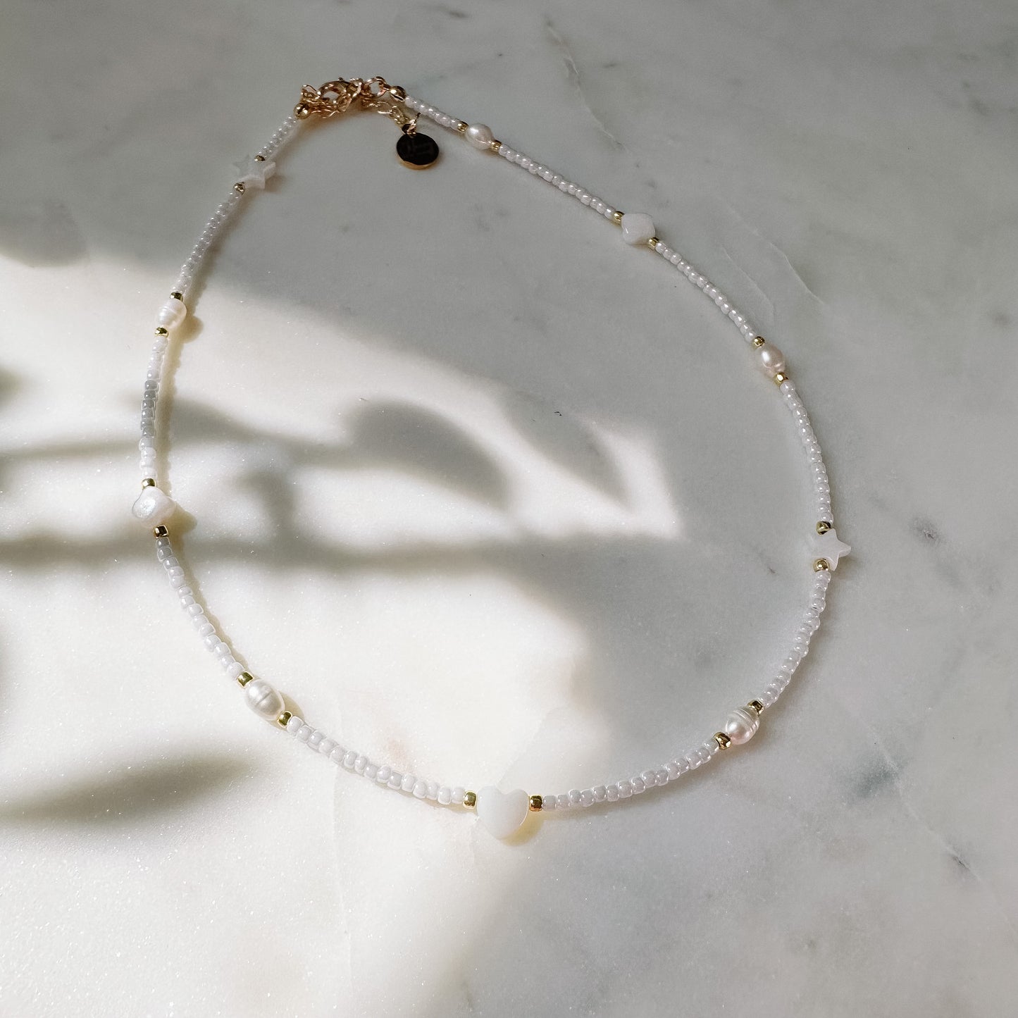 White choker with shell and pearl elements