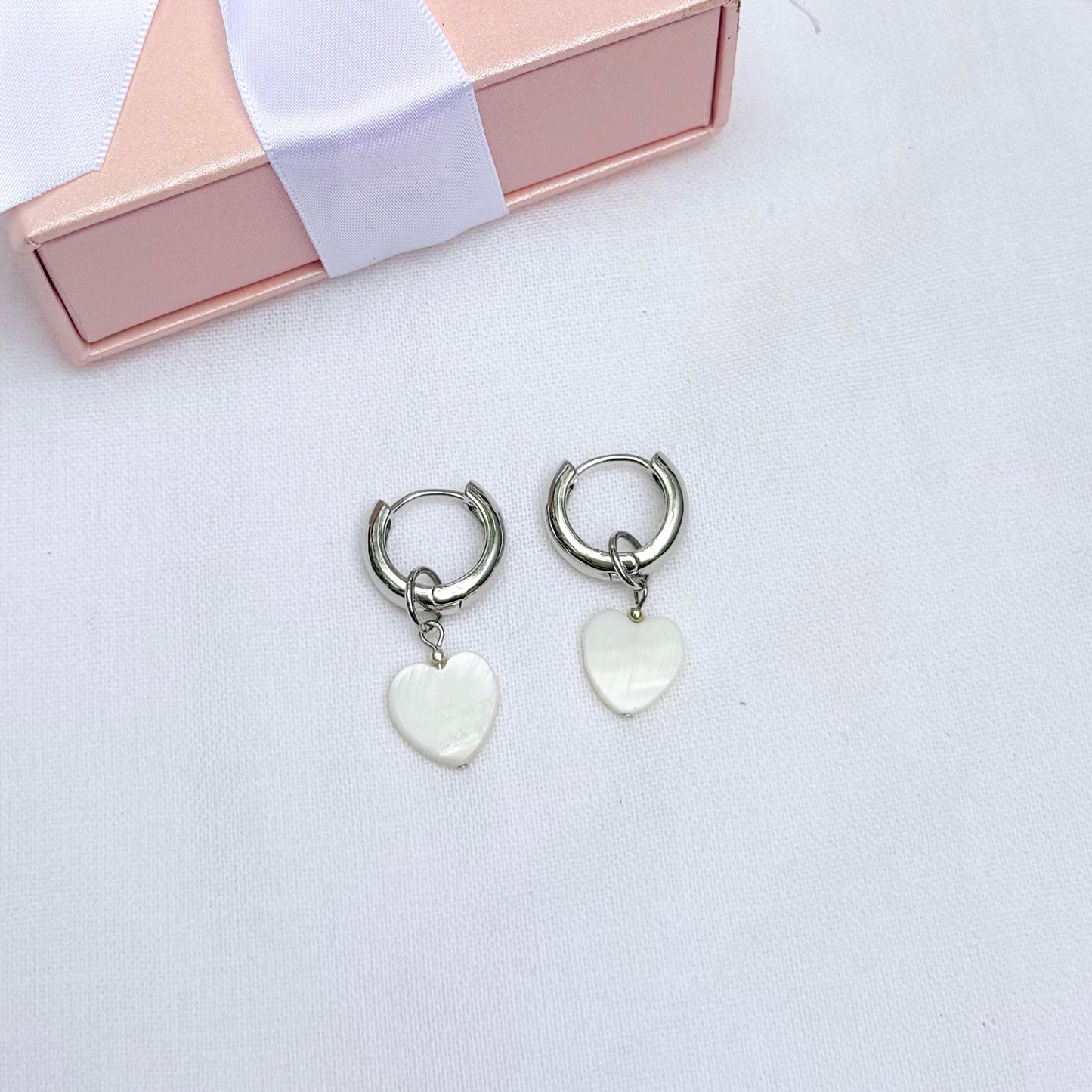 Hoop earrings with interchangeable heart pendants