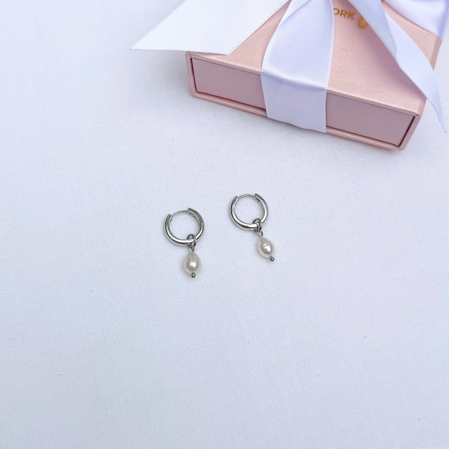 Minimalist pearl hoop earrings with interchangeable pendants