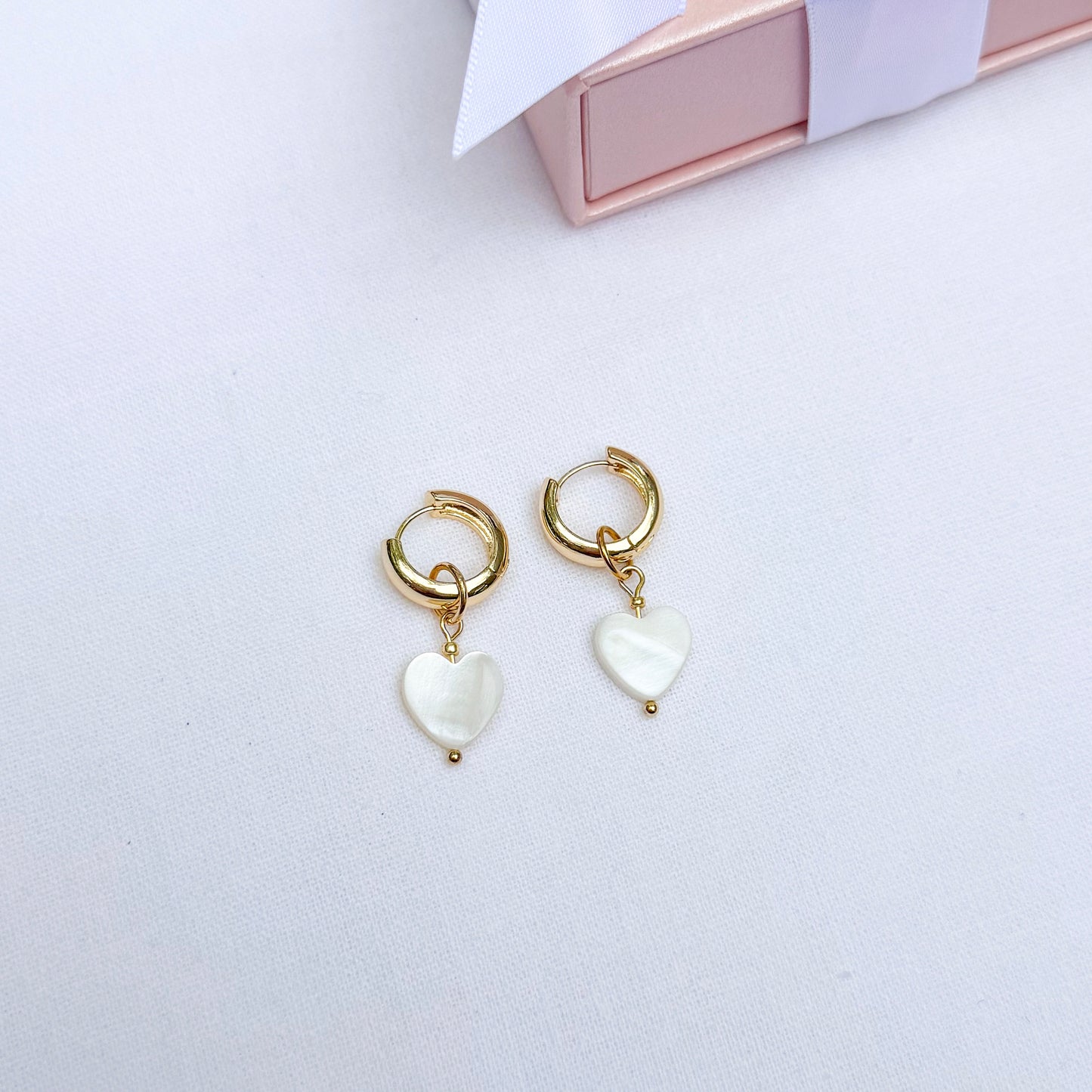 Hoop earrings with interchangeable heart pendants