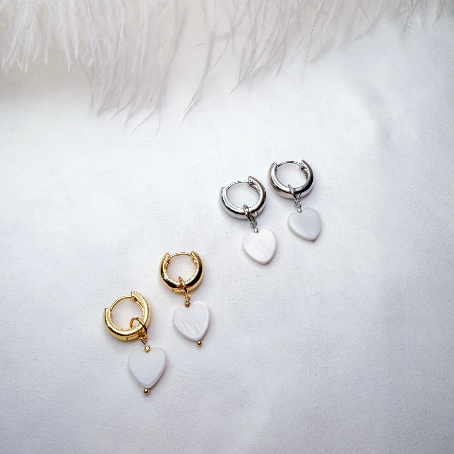 Hoop earrings with interchangeable heart pendants