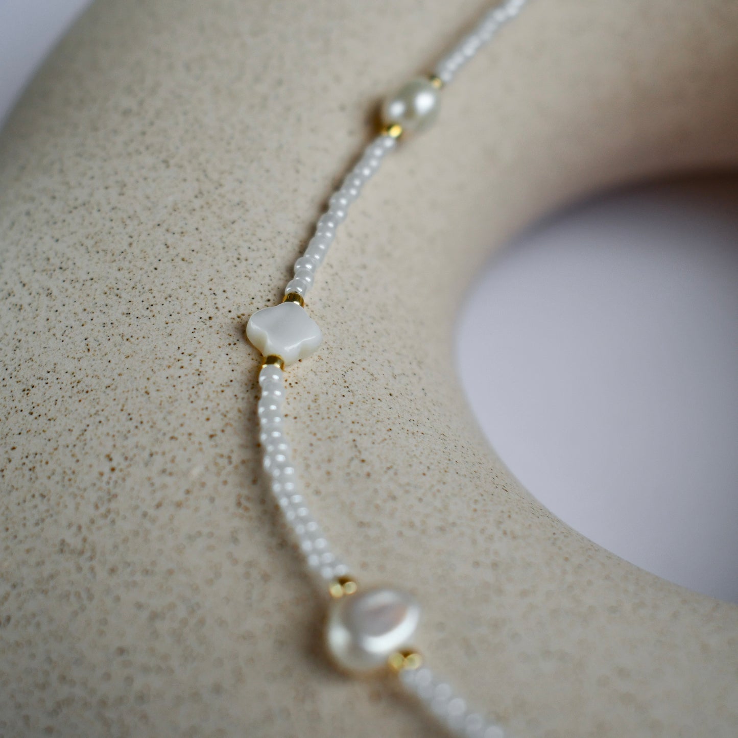 White choker with pearls and shell beads
