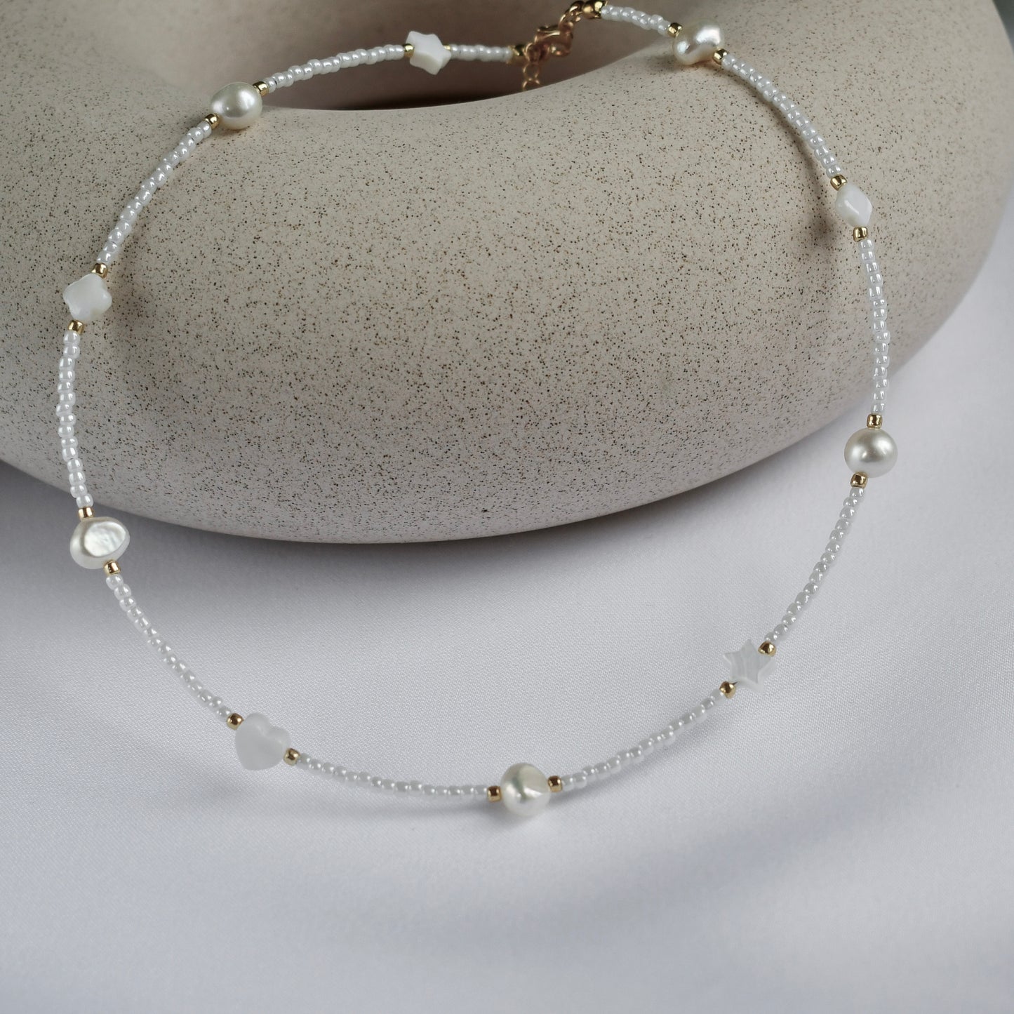 White choker with pearls and shell beads