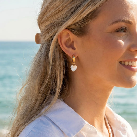 Hoop earrings with interchangeable heart pendants