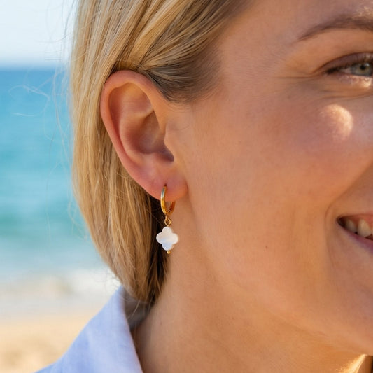 Earrings with mother of pearl clover pendants