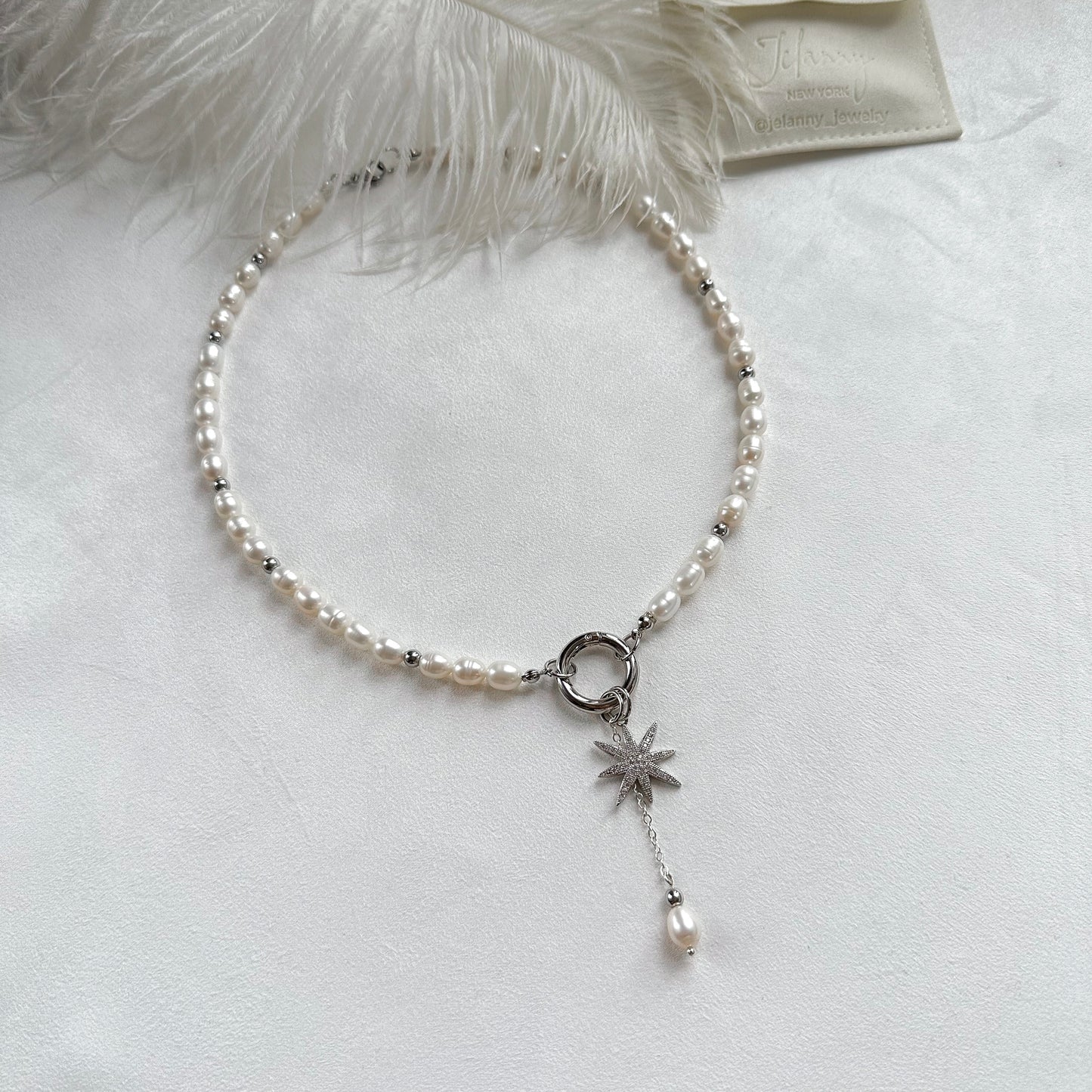 Necklace with star and pearl interchangeable pendants