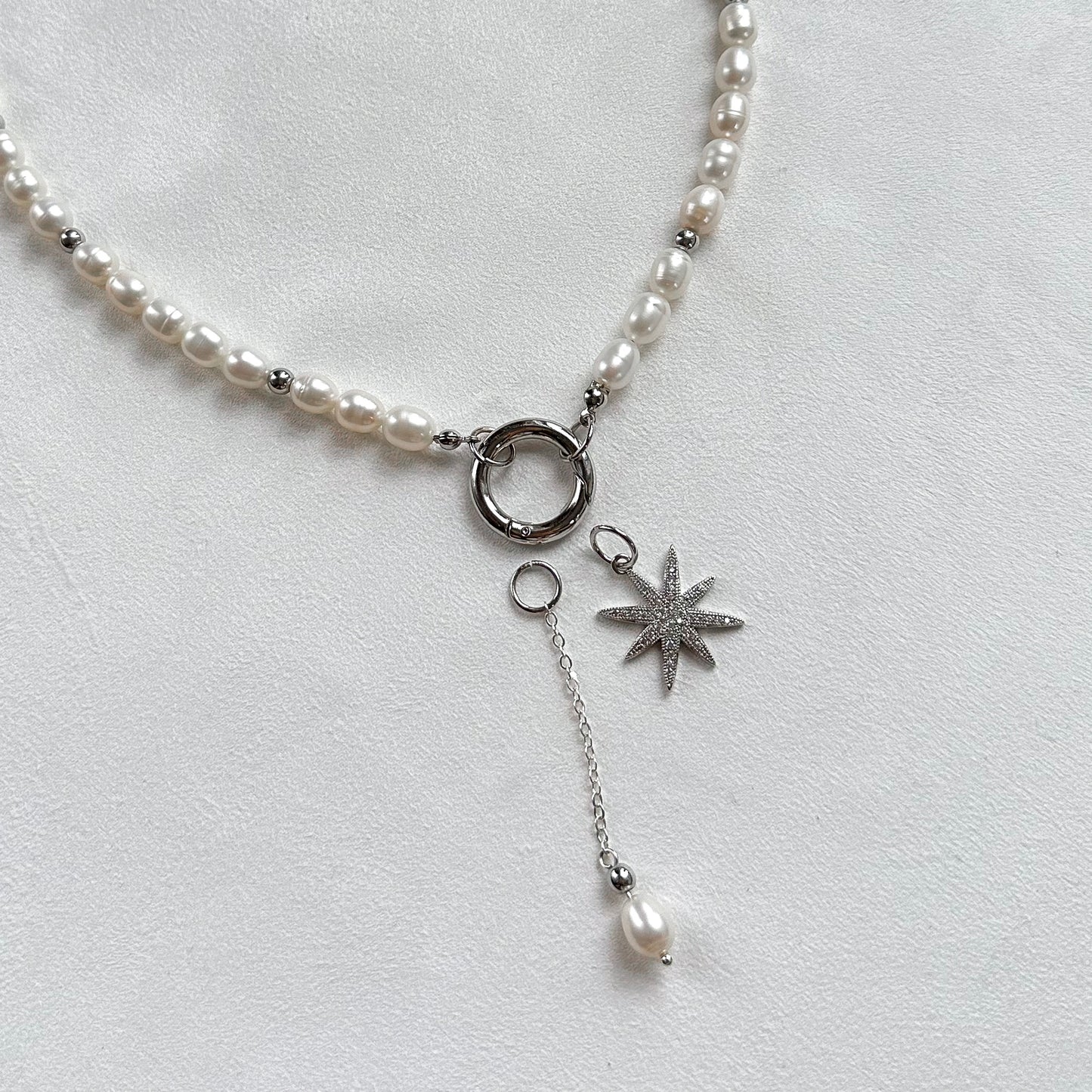 Necklace with star and pearl interchangeable pendants