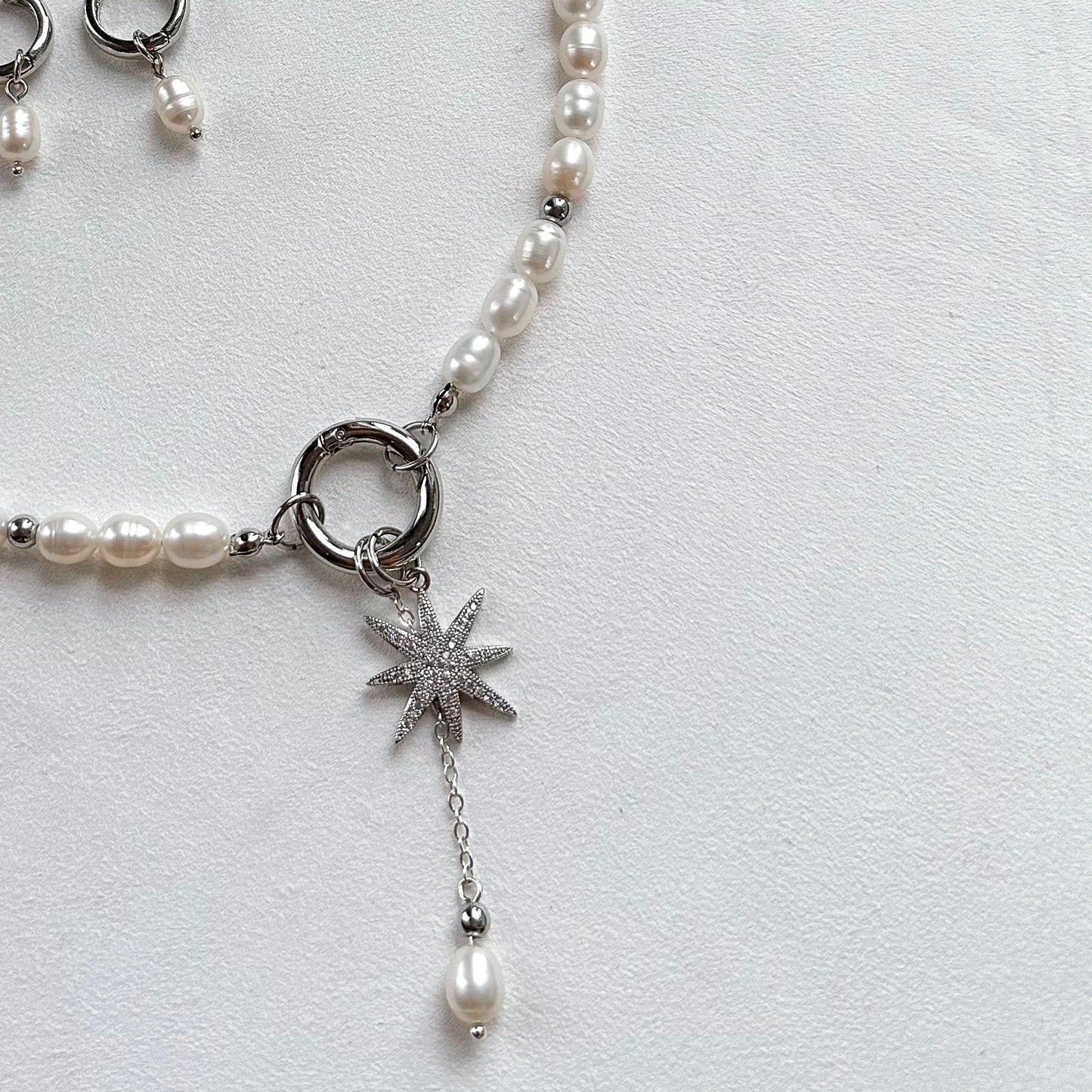 Necklace with star and pearl interchangeable pendants
