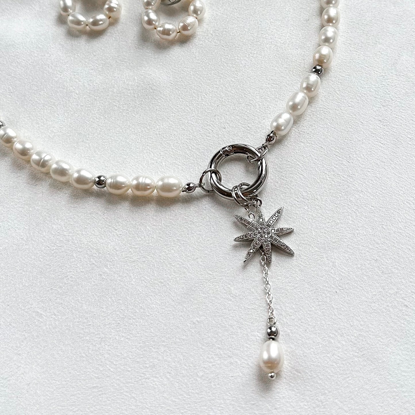Necklace with star and pearl interchangeable pendants