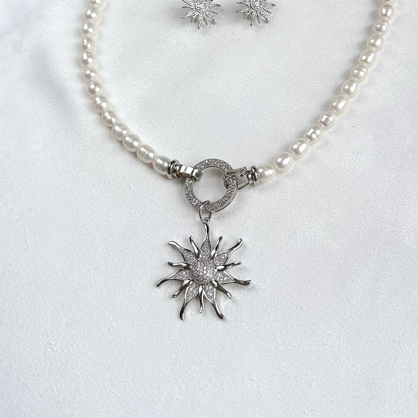 Necklace with sunburst pendant