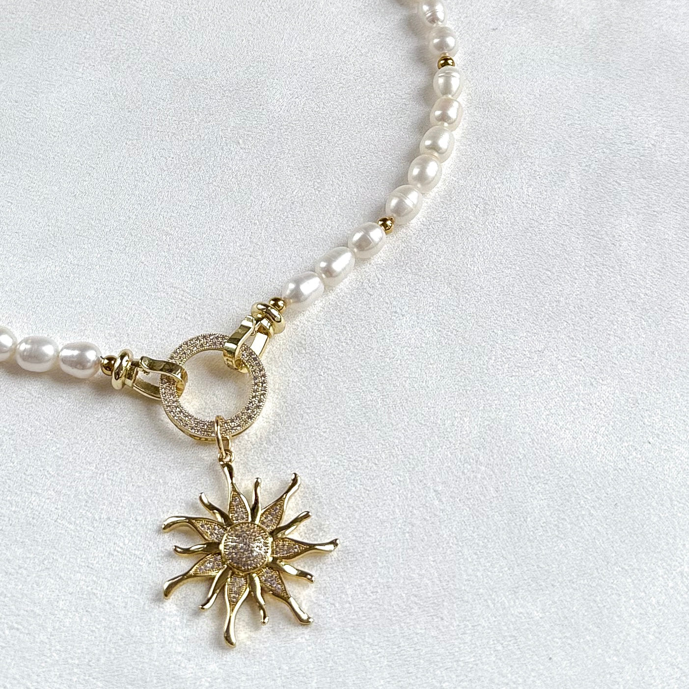 Necklace with sunburst pendant