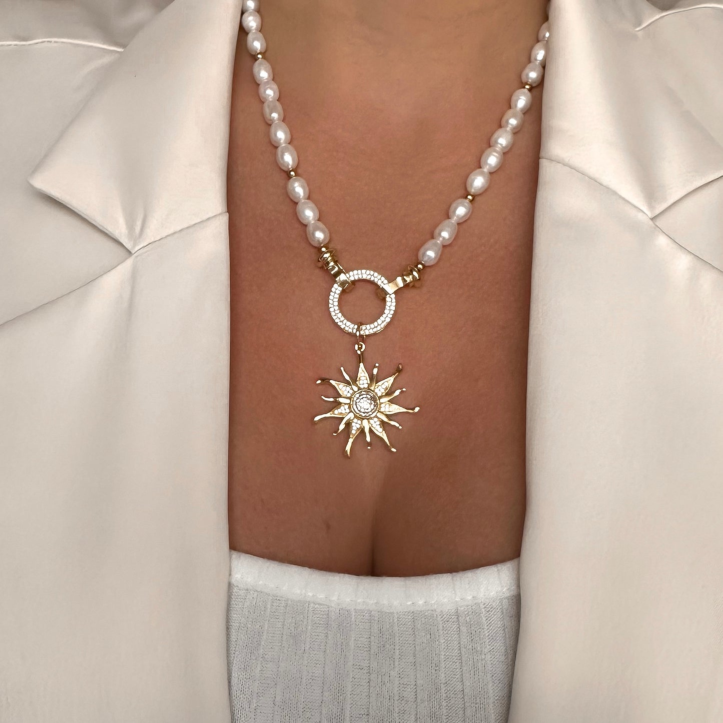 Necklace with sunburst pendant