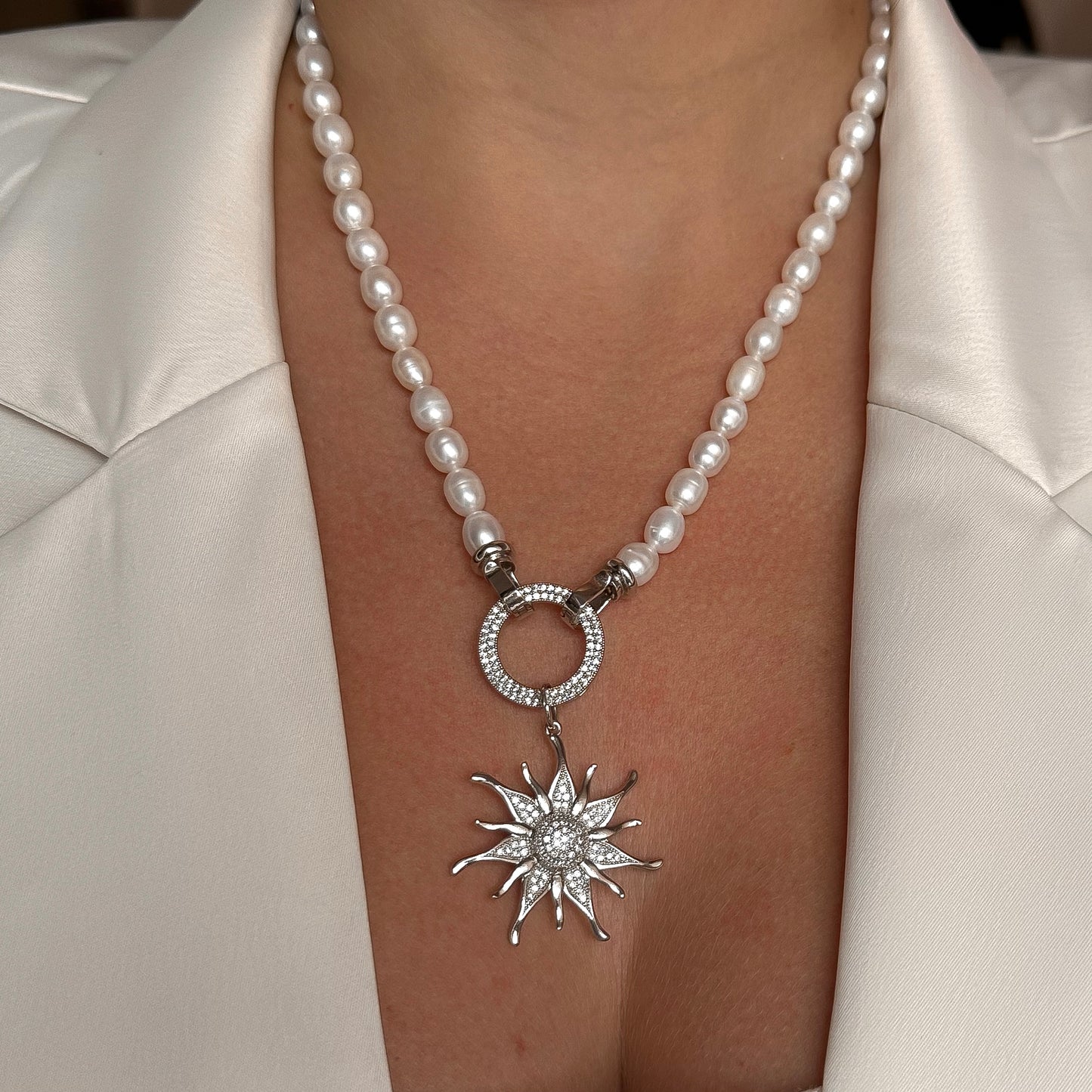 Necklace with sunburst pendant