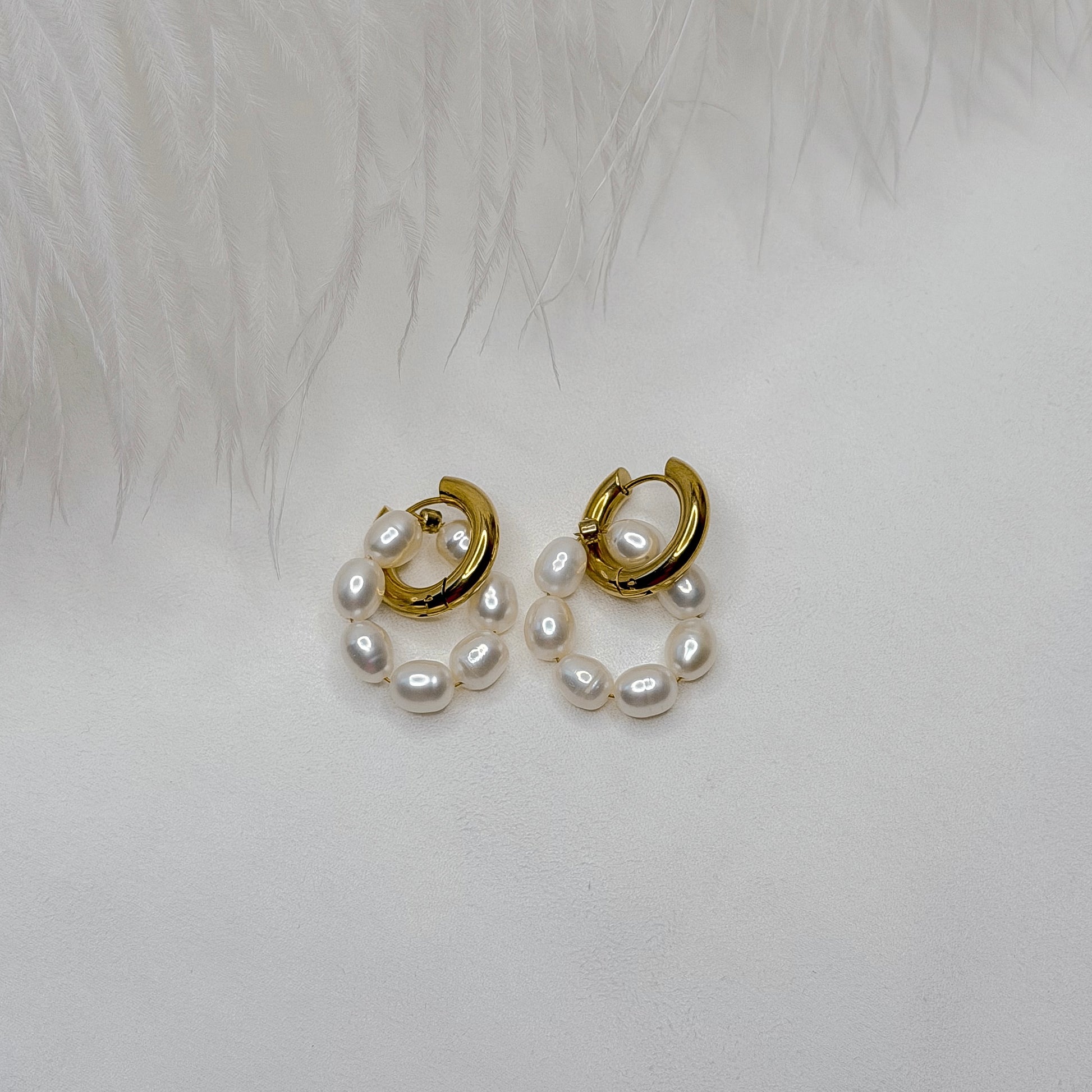 pearl hoop earrings interchangeable charms close up product photo