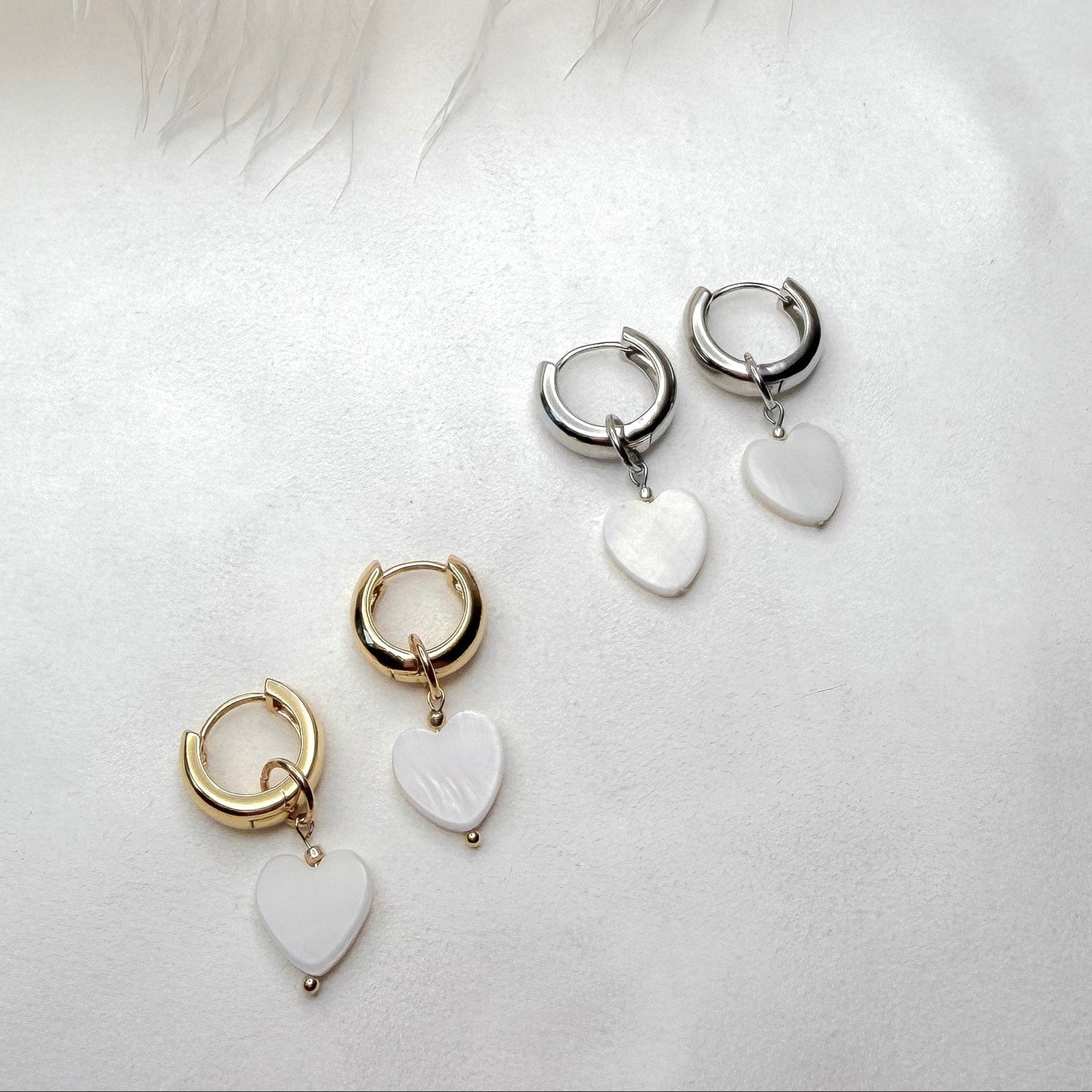 Hoop earrings with interchangeable heart pendants