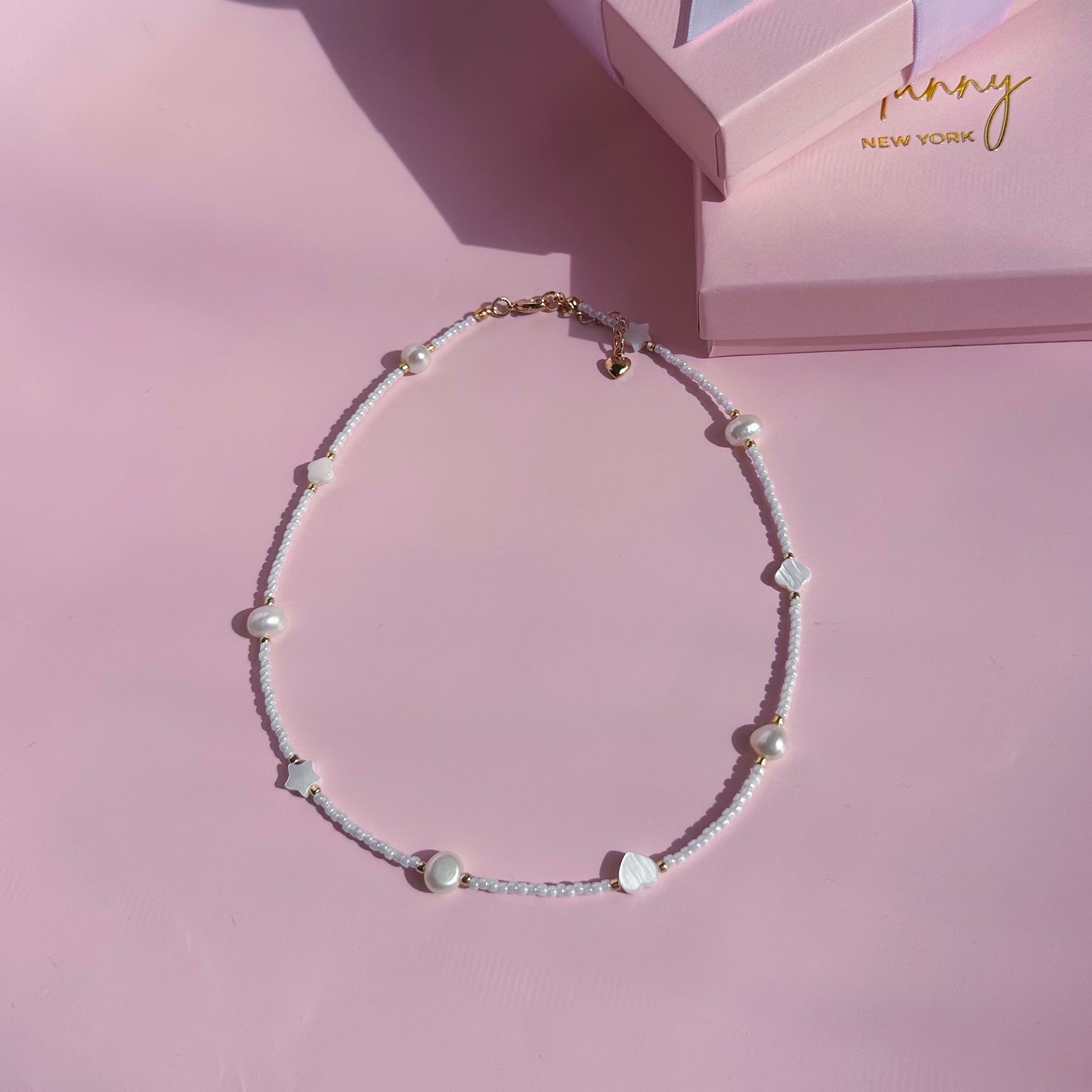 White choker with pearls and shell beads