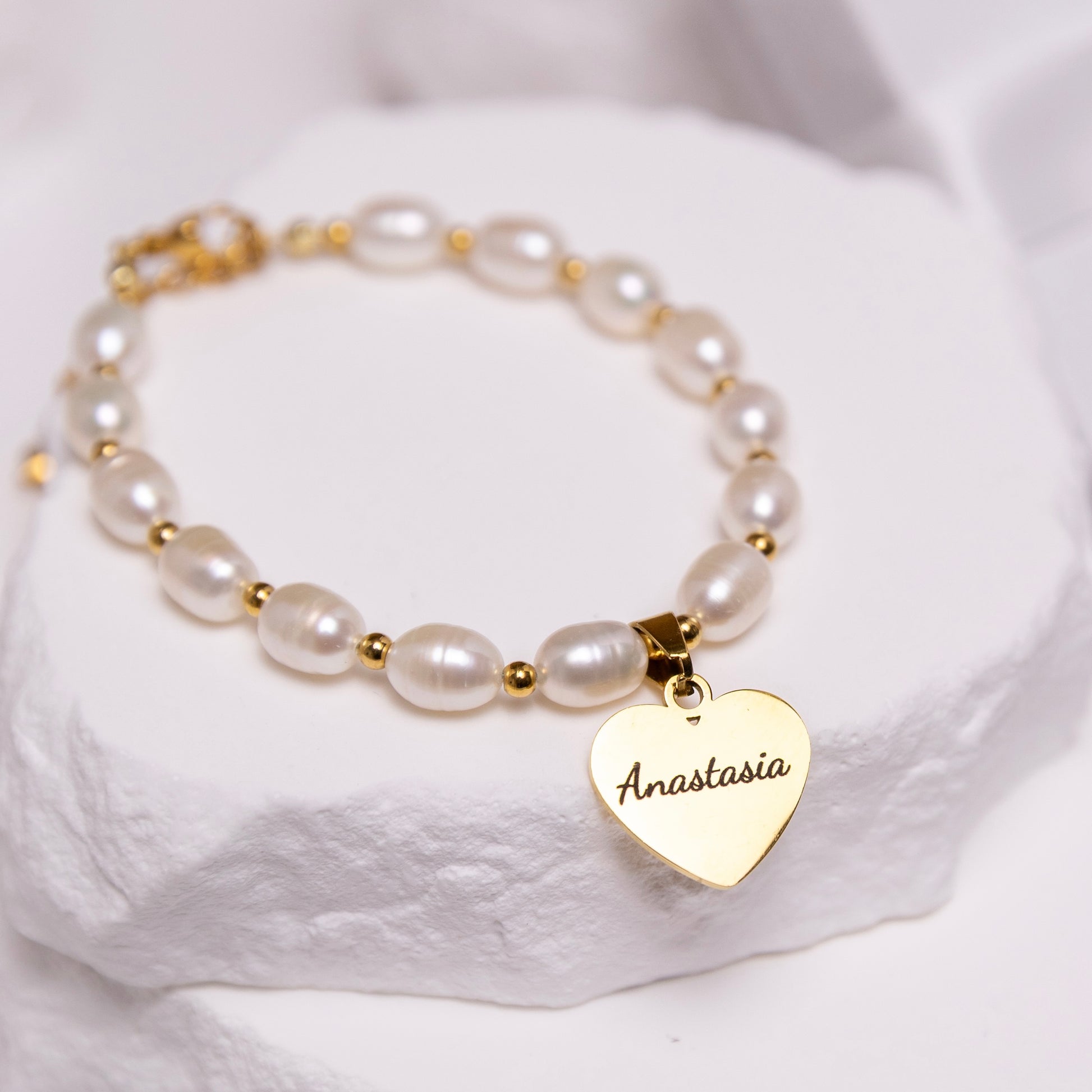 Rice pearl bracelet close up engraved heart detail