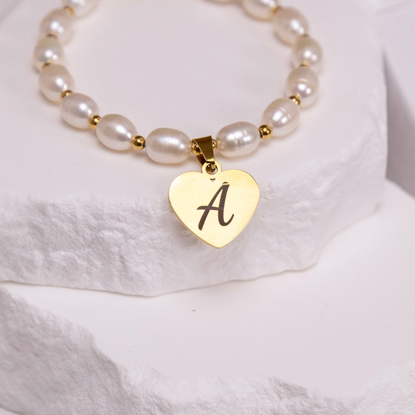 Modern pearl jewelry bracelet with engraved heart