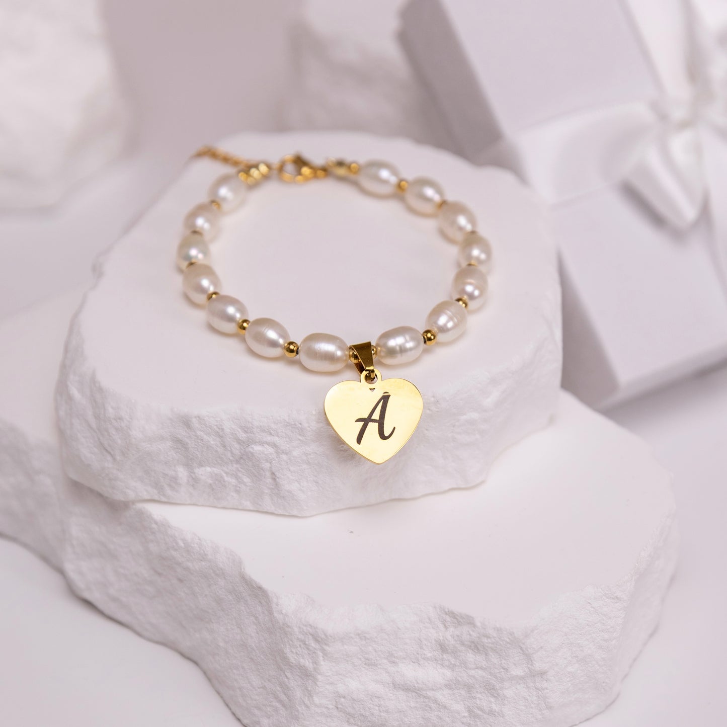 Silver finish pearl bracelet with engraved heart charm