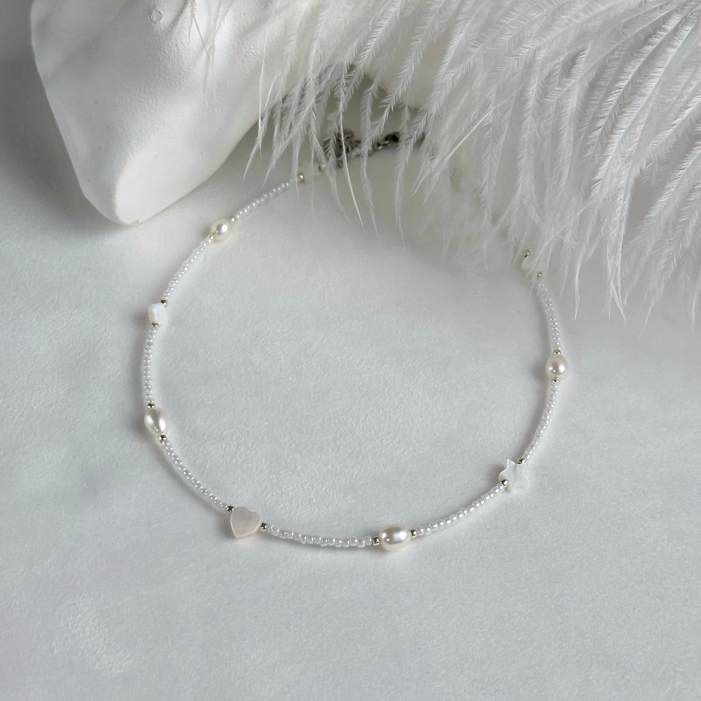 White choker with pearls and shell beads