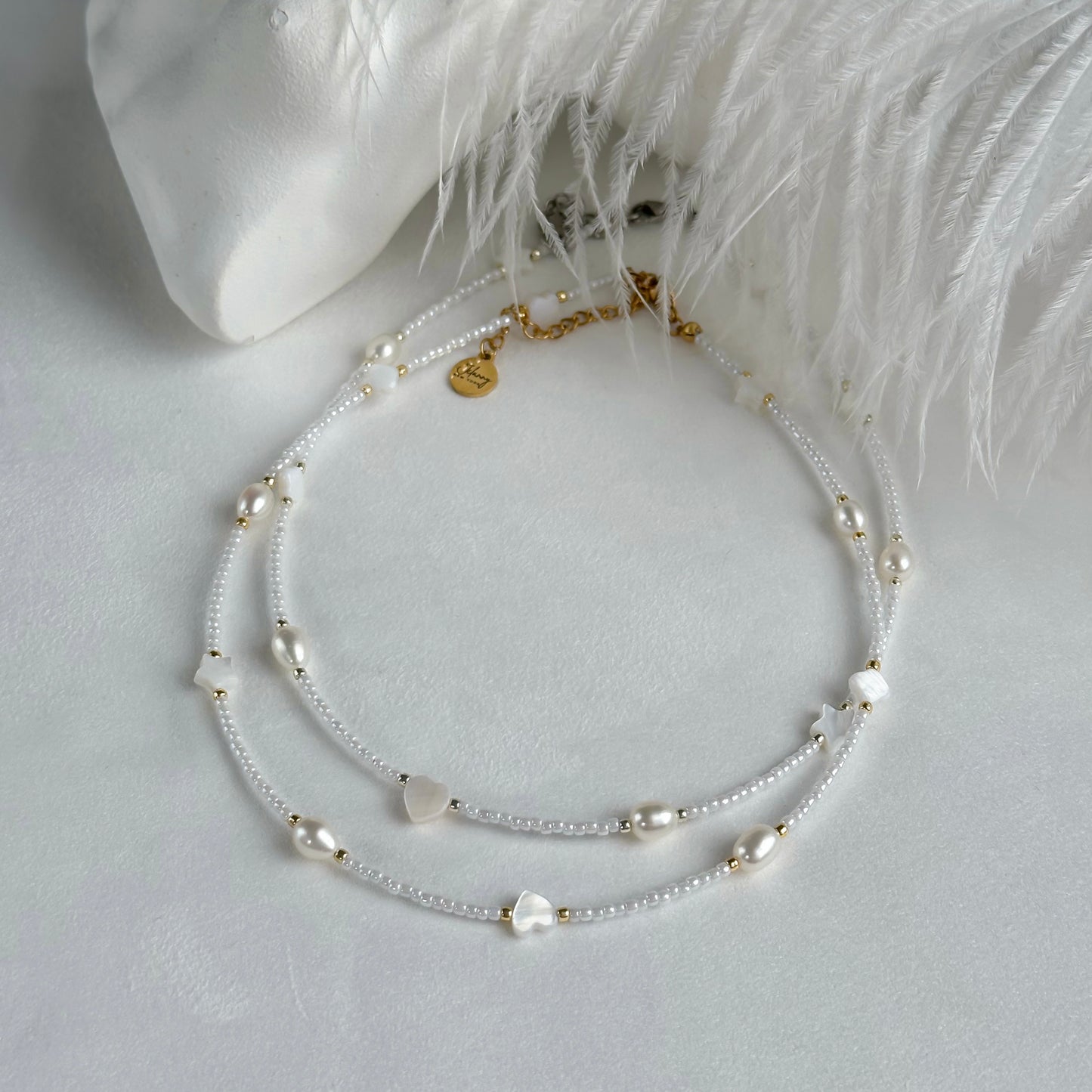 White choker with pearls and shell beads