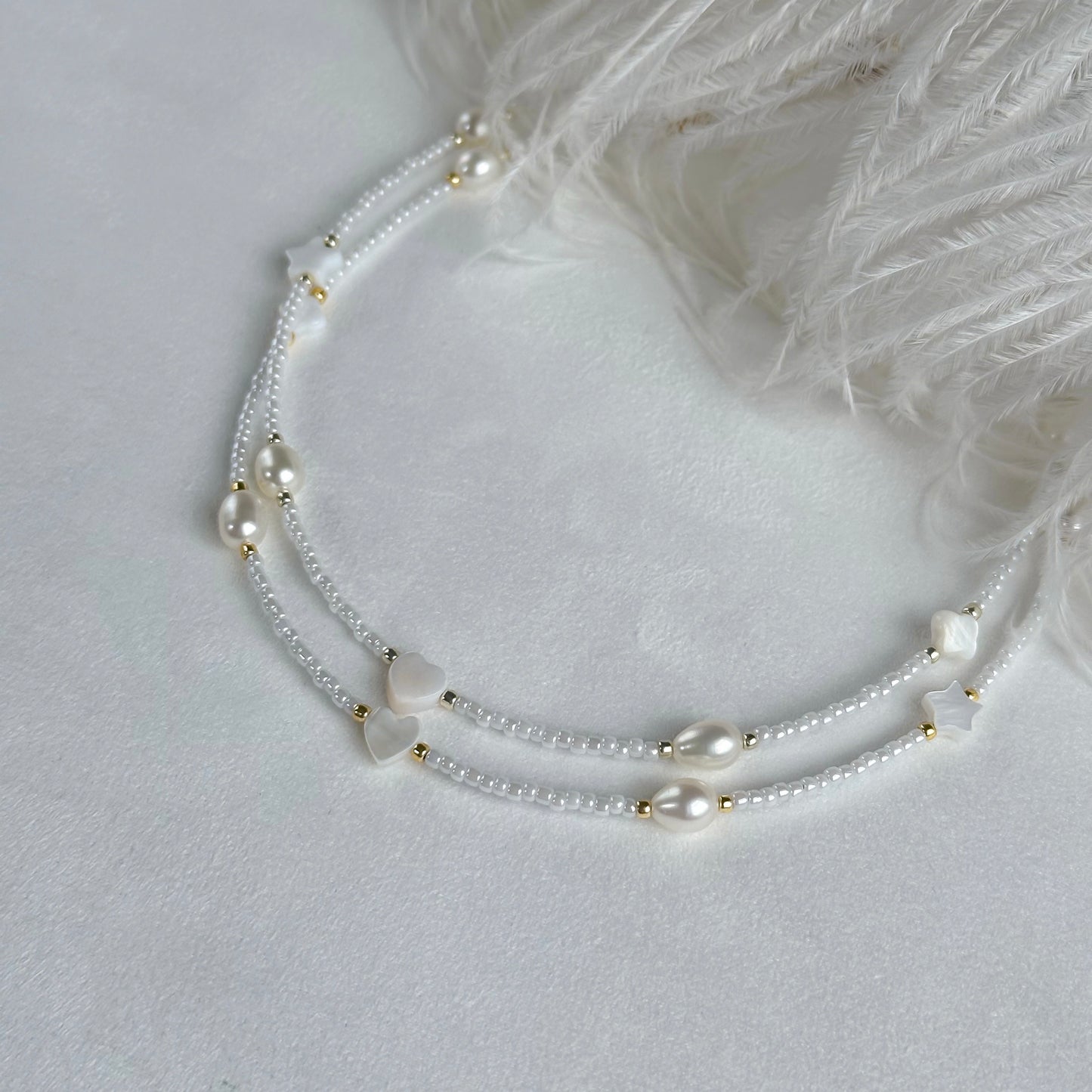 White choker with pearls and shell beads