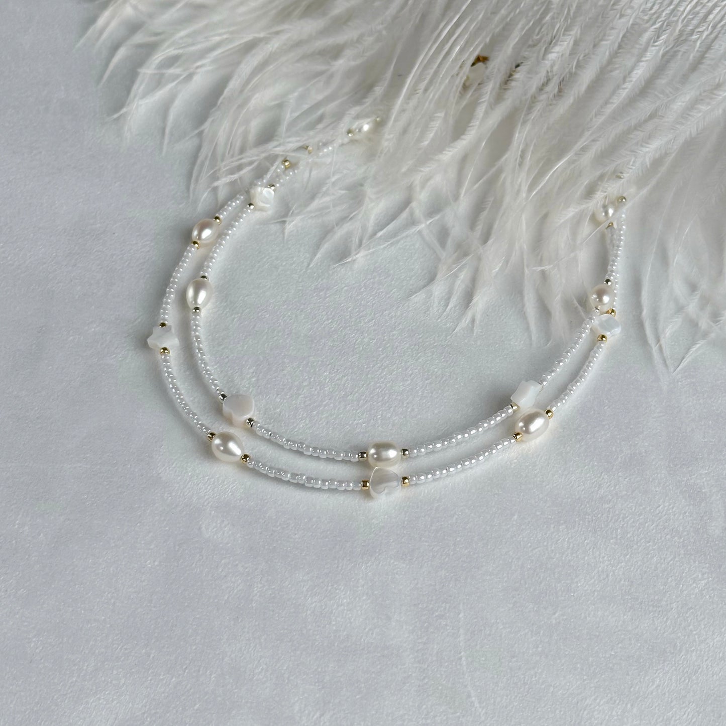 White choker with pearls and shell beads